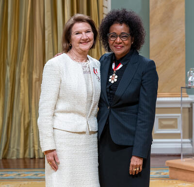 Cristina Amon is standing next to The Right Honourable Michaëlle Jean.