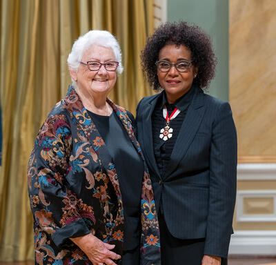 B. Lynn Beattie is standing next to The Right Honourable Michaëlle Jean.