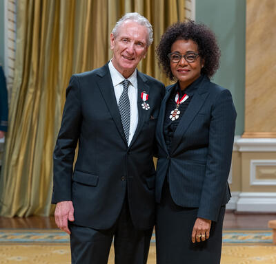 Eric D. Friesen is standing next to The Right Honourable Michaëlle Jean.