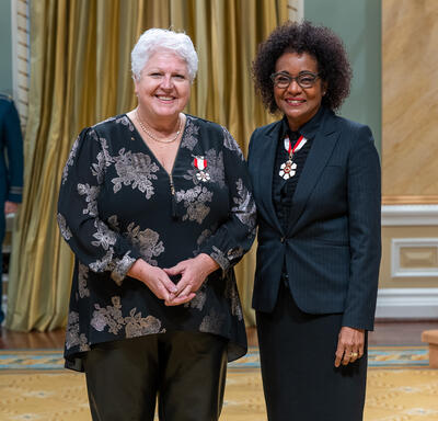 Maria Labrecque-Duchesneau is standing next to The Right Honourable Michaëlle Jean.