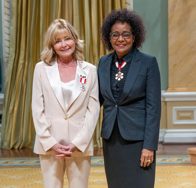 Beverly Thomson is standing next to The Right Honourable Michaëlle Jean.