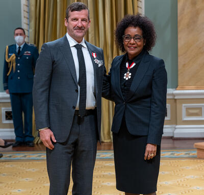 Darren Throop is standing next to The Right Honourable Michaëlle Jean.