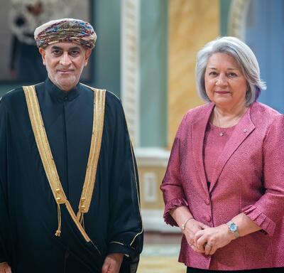 Governor General Simon is standing next to His Excellency Moosa Hamdan Moosa Al Tai.