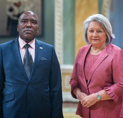 Governor General Simon is standing next to His Excellency Cecil Toendepi Chinenere.
