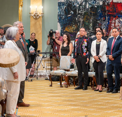 Governor General Marie Simon stands during a cultural performance