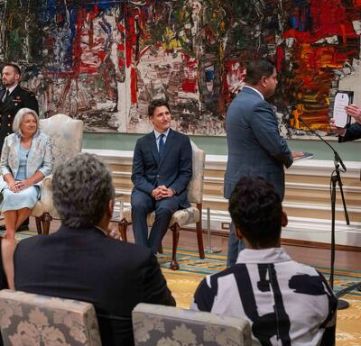 Governor General Marie Simon watches Minister Gary Anandasangaree as he reads his oath