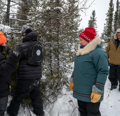 Governor General Mary Simon watches Junior Rangers build shelters