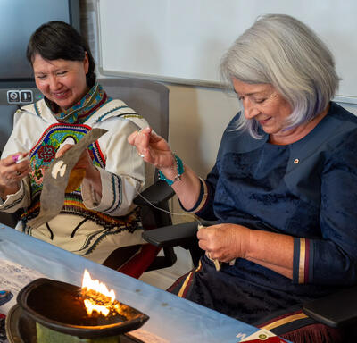 Governor General Mary Simon has a needle in hand as she sews a piece of fur