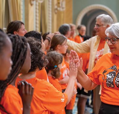 Governor General Mary Simon welcoming school children in the Ballroom at Rideau Hall.