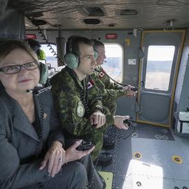 Her Honour the Honourable Judy Foote, Lieutenant Governor of Newfoundland and Labrador, alongside the commander of the base, Lieutenant-Colonel Stéphane Racle, also participated in the familiarization flight.