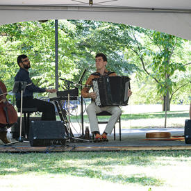 The Ladom Ensemble quartet performs on the grounds of Rideau Hall, under a tent, for Chamberfest.