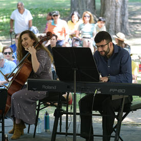 The Ladom Ensemble quartet performs on the grounds of Rideau Hall, under a tent, for Chamberfest.