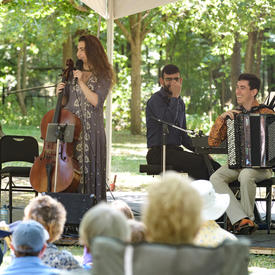 The cellist for Ladom Ensemble thanks the crowd on the grounds of Rideau Hall who came to listen.