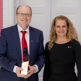 Dr. Garnette Sutherland poses for a picture with the Governor General.