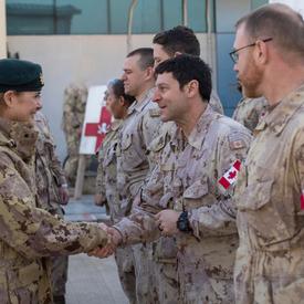 Governor General Julie Payette shakes hands with members of the Canadian Armed Forces.