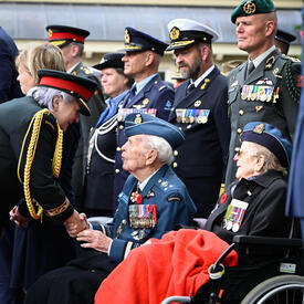 Governor General Mary Simon meeting a veteran at the Freedom Parade. 