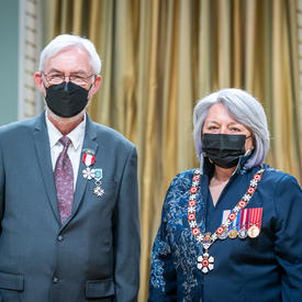 Imant Karlis Raminsh is standing next to the Governor General.