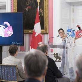 The ceremony also showcased June’s Final Five winners of SSHRC’s annual Storytellers competition. The first storyteller was Michiko Maruyama.