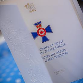 A photo of the Order of Merit of the Police Forces Program.