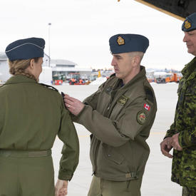  The Governor General receives a military patch by a CAF member. 