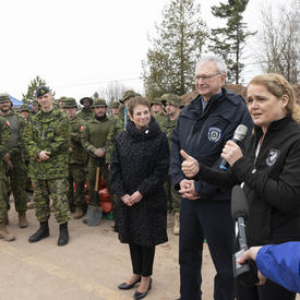 The Governor General addresses a group of people. 