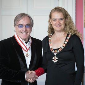  Daniel Lamarre shakes hands with the Governor General.