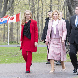 The Governor General, the President of the Republic of Croatia and Mr. Jakov Kitarović walk with each other on the grounds of Rideau Hall. 