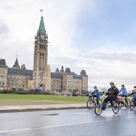 Cyclists depart from Parliament Hill by bike