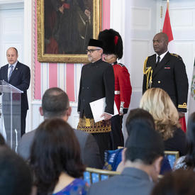 His Excellency Abdul Kadir Jailani, Ambassador of the Republic of Indonesia, is standing at the front of the room. 