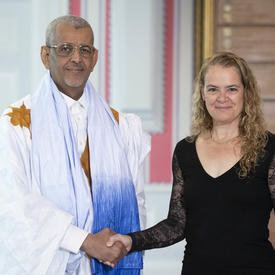 His Excellency Sidi Mohamed Taleb Amar, Ambassador of the Islamic Republic of Mauritania, is shaking the Governor General’s hand. 