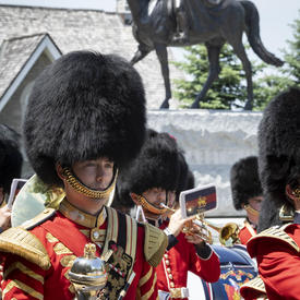 The Band of the Ceremonial Guard perform in front of the Queen Elizabeth II Equestrian Monument. 