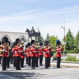 The Band of the Ceremonial Guard perform in front of the Queen Elizabeth II Equestrian Monument. 