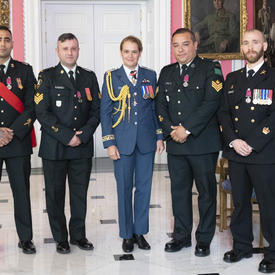 Petty Officer 1st Class Charles Bressette, Sergeant Andrea Karistinos and master corporals Kashif Dar and Jesus Castillo take a photo with the Governor General.