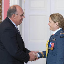 Martin Abud shakes hands with and thanks the Governor General.