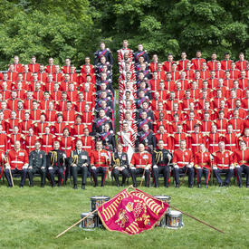 Members of the Ceremonial Guard gather to take a group photo, creating a sea of red.