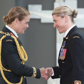 Chief Petty Officer 2nd Class Tanya Lea Leavitt shakes hands with the Governor General.