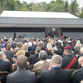 A photo of the roughly 1,200 guests in attendance from behind, as the Governor General delivers remarks.