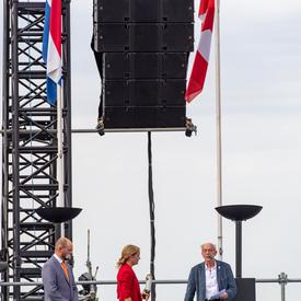 The Governor General on stage at the commemorative ceremony in Terneuzen, prepared to light a flame.