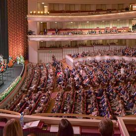 A photo of guests seated inside the Grand Theatre in Warsaw, Poland.