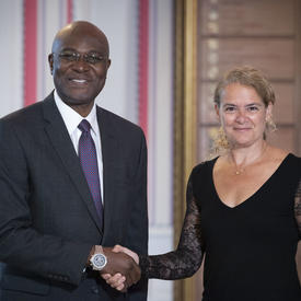 His Excellency Mpoki Mwasumbi Ulisubisya, High Commissioner for the United Republic of Tanzania, shakes hands with the Governor General. 
