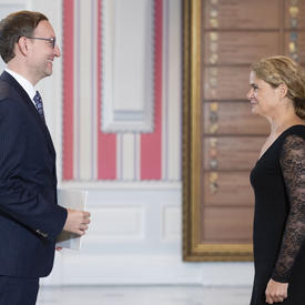His Excellency Bořek Lizec, Ambassador of the Czech Republic, stands in front of the Governor General. 