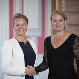 Her Excellency Hanne Fugl Eskjaer, Ambassador of the Kingdom of Denmark, shakes hands with the Governor General. 