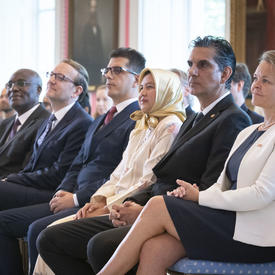 The crowd looking toward the front of the room.