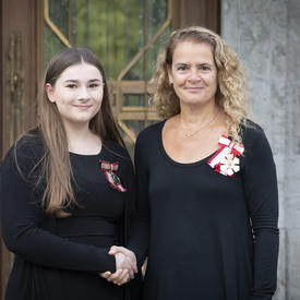The Governor General shakes hands with a recipient during the Mixed Honours ceremony.