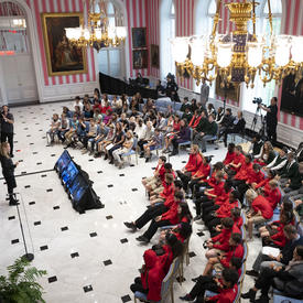 A photo of the tent room filled with students and teachers during a question and answer session with the Governor General. 