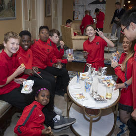 A photo of students tasting their 'space' snacks following the question and answer session with the Governor General.