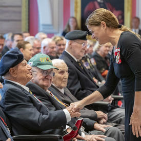The Governor General shakes hands with a veteran during the launch of the 2019 National Poppy Campaign.