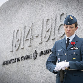 An officer stands solemnly by the monument during the National Remembrance Day Ceremony. 