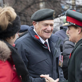 The Governor General speaks with a veteran at the National Remembrance Day Ceremony. 