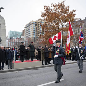 The Governor General salutes veterans as they march on. 